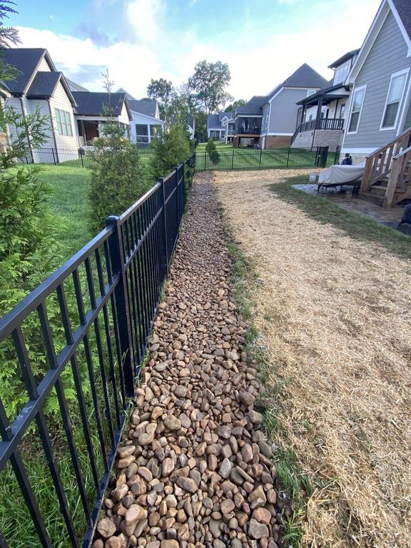 Decorative open French drain — natural stone finish