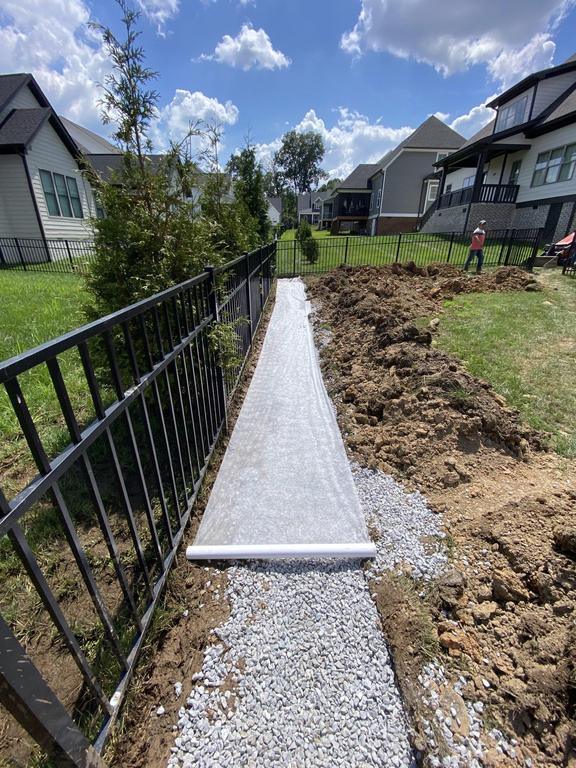 Hidden channel drain integrated into walkway