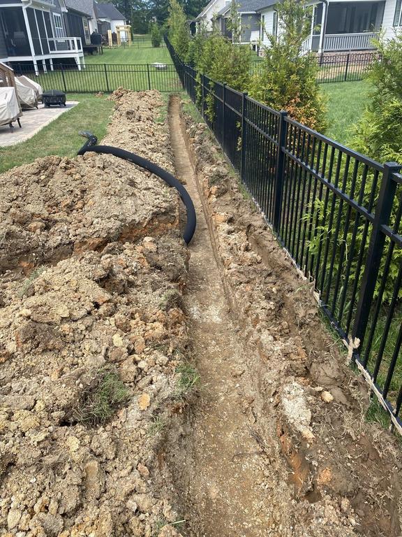 Finished decorative walkway with concealed drainage